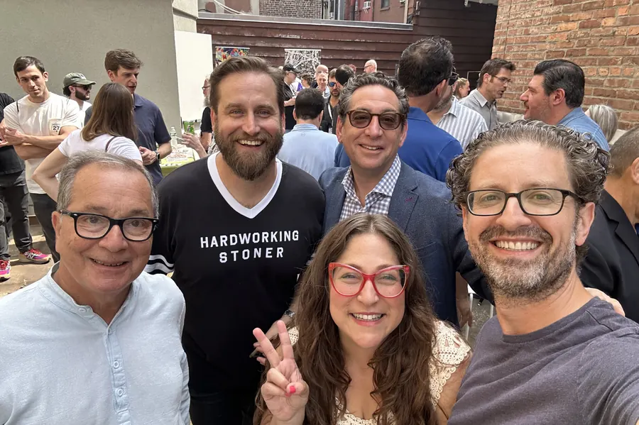 Five Jews in Weed organizers, including Shelby Poole in red glasses, taking a group selfie at the CWCBE Bagel Bash in 2025