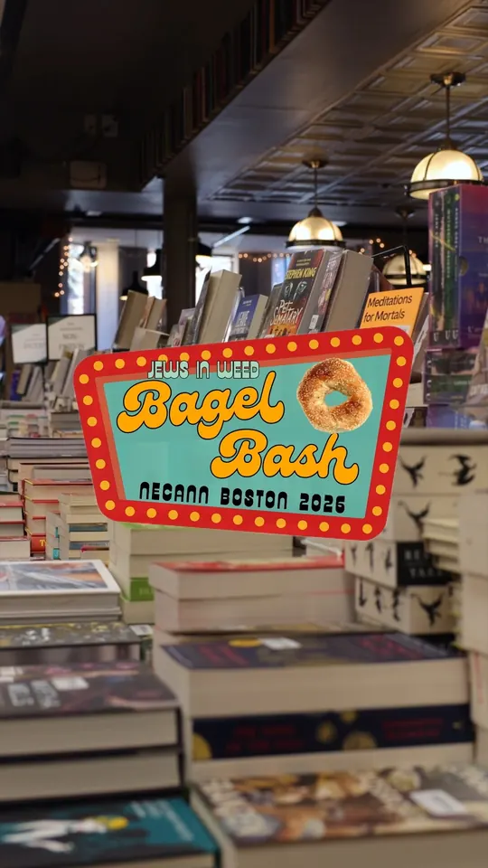 Bagel Bash NECANN Boston 2026 sign over the book displays at Trident Booksellers and Cafe