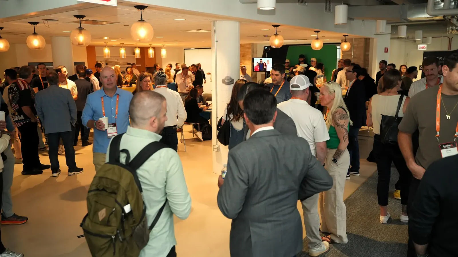 A packed room of attendees mingling at the IgniteIt Chicago Bagel Bash