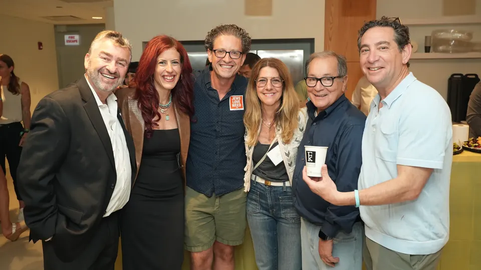 Six friends posing together at the IgniteIt Chicago Bagel Bash